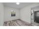 Light-filled dining area with hardwood floors and view to kitchen at 529 Ambassador St, Charlotte, NC 28208