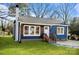 Charming blue house with white accents and wood shutters at 529 Ambassador St, Charlotte, NC 28208