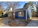 Updated blue house with white accents, shutters, and walkway at 529 Ambassador St, Charlotte, NC 28208