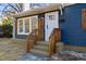 House exterior with blue siding, wooden steps, and shutters at 529 Ambassador St, Charlotte, NC 28208