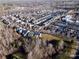 An aerial view of a well-planned residential community featuring cozy homes and tree-lined streets during the late fall season at 5636 Whitehawk Hill Rd, Mint Hill, NC 28227