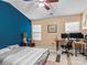 Spacious bedroom with a ceiling fan, workspace and accent wall at 5636 Whitehawk Hill Rd, Mint Hill, NC 28227