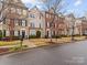 Row of townhouses with appealing brick and stone exteriors, and neatly landscaped yards at 5636 Whitehawk Hill Rd, Mint Hill, NC 28227