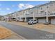 Row of townhouses with private decks and garages at 5636 Whitehawk Hill Rd, Mint Hill, NC 28227