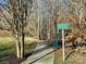 The image shows the greenway entrance, inviting residents to embrace an active lifestyle and explore nature trails at 5636 Whitehawk Hill Rd, Mint Hill, NC 28227