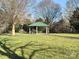 A serene park view with a covered picnic area, inviting residents to enjoy outdoor relaxation and community gatherings at 5636 Whitehawk Hill Rd, Mint Hill, NC 28227