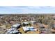 A scenic aerial view captures a residential area near the city skyline, nestled among lush trees and well-maintained homes at 5818 Harris Grove Ln, Charlotte, NC 28212