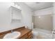 Full bathroom featuring a vanity, toilet, and shower-tub combo at 5818 Harris Grove Ln, Charlotte, NC 28212