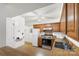 Traditional-style kitchen with wood cabinets, white appliances, and vinyl flooring at 5818 Harris Grove Ln, Charlotte, NC 28212