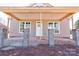 Covered front porch with brick columns and concrete flooring at 604 E Ridge St, Kings Mountain, NC 28086