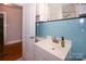 Bathroom with light blue tiled walls and vanity with sink at 617 York S Ave, Rock Hill, SC 29730