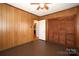 Bedroom with wood paneling, ceiling fan and built-in closet at 617 York S Ave, Rock Hill, SC 29730