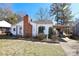 Charming white house with brick chimney and carport at 617 York S Ave, Rock Hill, SC 29730