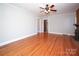 Hardwood floor living room with brick fireplace and view of kitchen at 617 York S Ave, Rock Hill, SC 29730