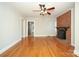 Hardwood floor living room with brick fireplace and view of kitchen at 617 York S Ave, Rock Hill, SC 29730