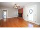 Living room with hardwood floors, brick fireplace, and ceiling fan at 617 York S Ave, Rock Hill, SC 29730