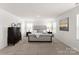 Main bedroom with plush carpet, large bed, and dresser at 642 Citriadora St, Fort Mill, SC 29715