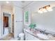 Bright bathroom with a single vanity, toilet, and shower at 7213 Fairway Vista Dr, Charlotte, NC 28226