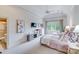 Bright bedroom with high ceilings, ceiling fan, and ensuite bathroom at 7213 Fairway Vista Dr, Charlotte, NC 28226