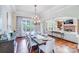 Open dining room with hardwood floors, chandelier and view of living room at 7213 Fairway Vista Dr, Charlotte, NC 28226