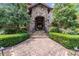 Elegant entryway with stone steps and iron railing at 7213 Fairway Vista Dr, Charlotte, NC 28226