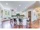 Spacious kitchen with large island, granite countertops, and white cabinets at 7213 Fairway Vista Dr, Charlotte, NC 28226