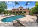 Large kidney shaped pool with lounge chairs and stone accents at 7213 Fairway Vista Dr, Charlotte, NC 28226