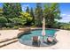 Relaxing pool with swim-up chairs and spa at 7213 Fairway Vista Dr, Charlotte, NC 28226