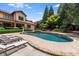 Luxury pool with stone deck and lounge chairs at 7213 Fairway Vista Dr, Charlotte, NC 28226