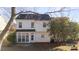 Exterior back of home features an enclosed porch, vinyl siding and a dark roof at 9635 Veronica Dr, Charlotte, NC 28215