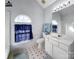 Bathroom featuring a tub, toilet, and vanity with a window to allow natural light at 9635 Veronica Dr, Charlotte, NC 28215