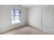 Empty bedroom featuring a window and a closet door at 9635 Veronica Dr, Charlotte, NC 28215