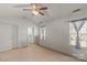 Neutral bedroom with ceiling fan showing door to ensuite bathroom at 9635 Veronica Dr, Charlotte, NC 28215