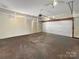 Empty garage with white walls and a ceiling fan at 9635 Veronica Dr, Charlotte, NC 28215