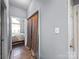 Hallway showcases tile floors and access to a bedroom with natural light from the bedroom windows at 9635 Veronica Dr, Charlotte, NC 28215