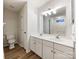 Bathroom features double vanity and updated fixtures at 10306 Creswell Ct, Charlotte, NC 28215