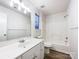 Clean bathroom with white vanity, tub, and flooring at 10306 Creswell Ct, Charlotte, NC 28215