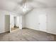 Main bedroom with carpet, ceiling fan, and en-suite bath at 10306 Creswell Ct, Charlotte, NC 28215