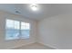 Bright bedroom with window and neutral walls at 1033 Cedar Village Trl, Salisbury, NC 28147