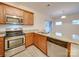 Modern kitchen with stainless steel appliances and granite countertops at 1033 Cedar Village Trl, Salisbury, NC 28147