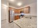 Modern kitchen with stainless steel appliances and granite countertops at 1033 Cedar Village Trl, Salisbury, NC 28147