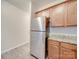 Stainless steel refrigerator in kitchen with granite countertop at 1033 Cedar Village Trl, Salisbury, NC 28147