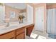 Full bathroom featuring a large vanity, a shower with curtain, and tiled flooring at 1107 Stonehenge Ln, Charlotte, NC 28216