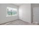 Bedroom with window, door and neutral walls at 132 Hayes Rd # 151, Kings Mountain, NC 28086