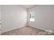 Small bedroom with window and neutral walls at 132 Hayes Rd # 151, Kings Mountain, NC 28086