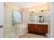 Bathroom features a double vanity, soaking tub, and walk-in shower at 13618 Pacific Echo Dr, Charlotte, NC 28277