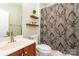 Simple bathroom with a shower/tub combo and wood vanity at 13618 Pacific Echo Dr, Charlotte, NC 28277