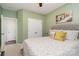 Light green bedroom with double doors to closet and access to another room at 13618 Pacific Echo Dr, Charlotte, NC 28277