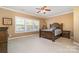 Spacious bedroom with carpeted floors and large windows at 13618 Pacific Echo Dr, Charlotte, NC 28277