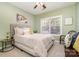 Bedroom with window, neutral decor, and a seating area at 13618 Pacific Echo Dr, Charlotte, NC 28277